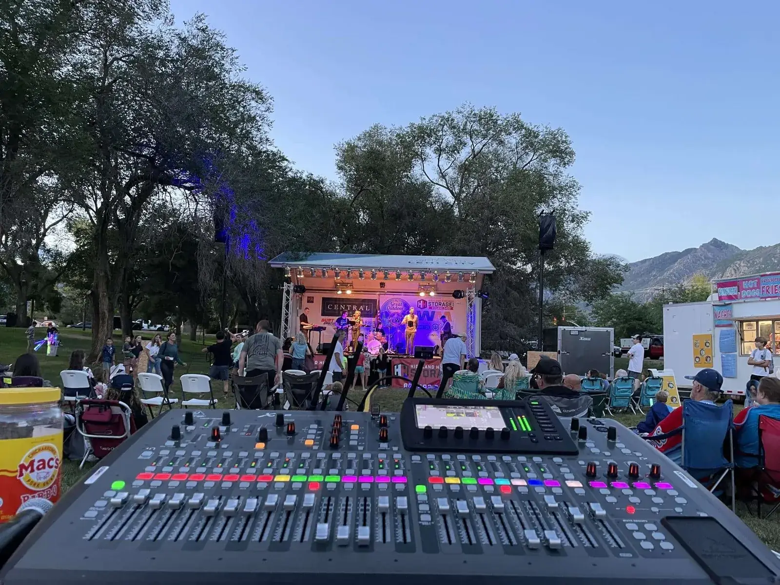 Professional mixing console ready at an outdoor stage before doors open