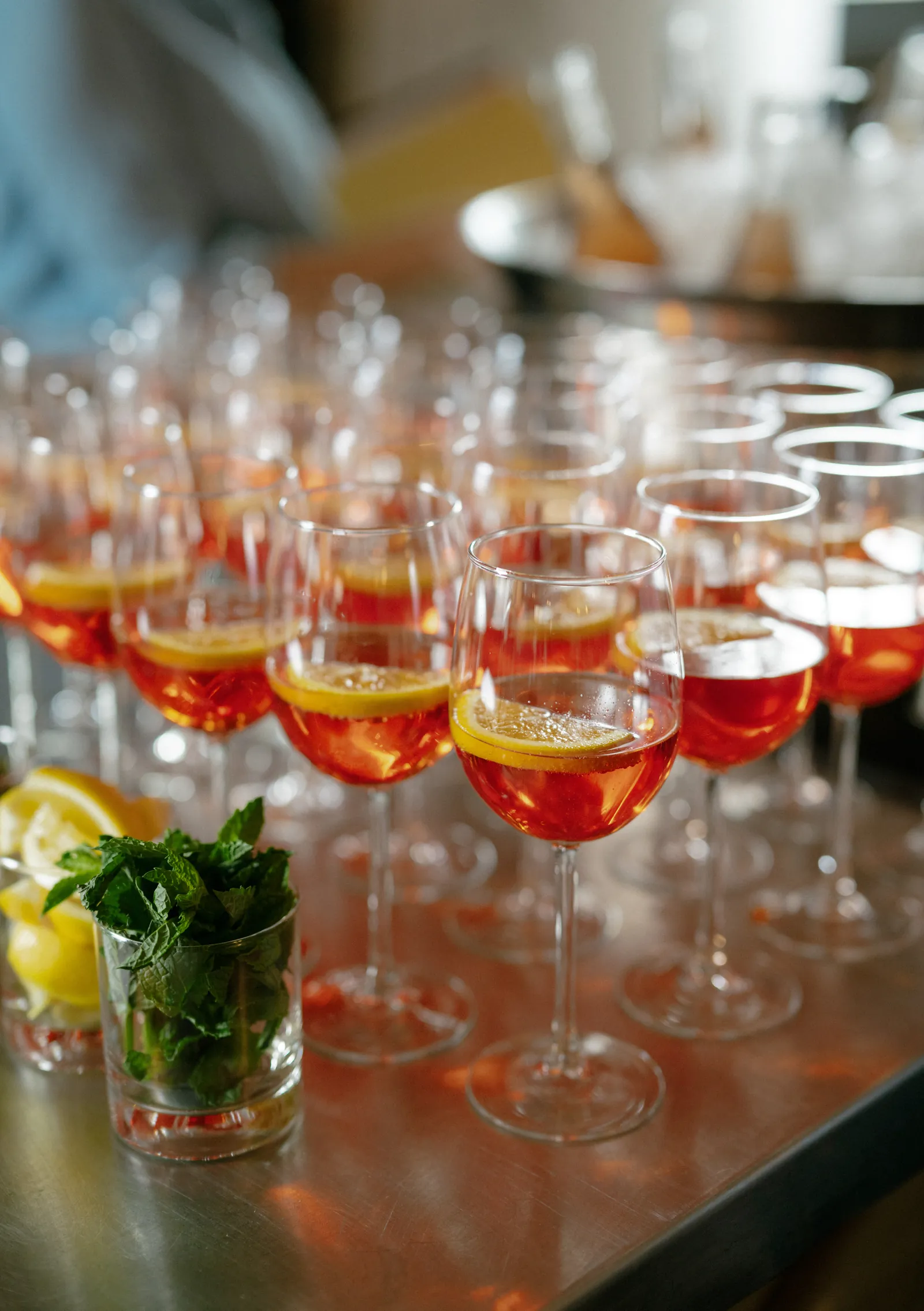Tray of spritz cocktails served during a golden-hour wedding cocktail hour