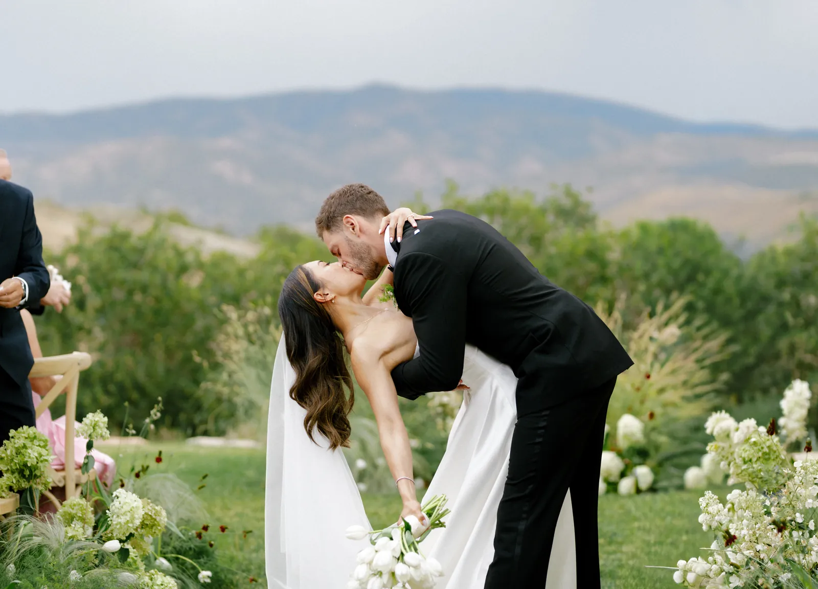 Dip kiss in the ceremony aisle