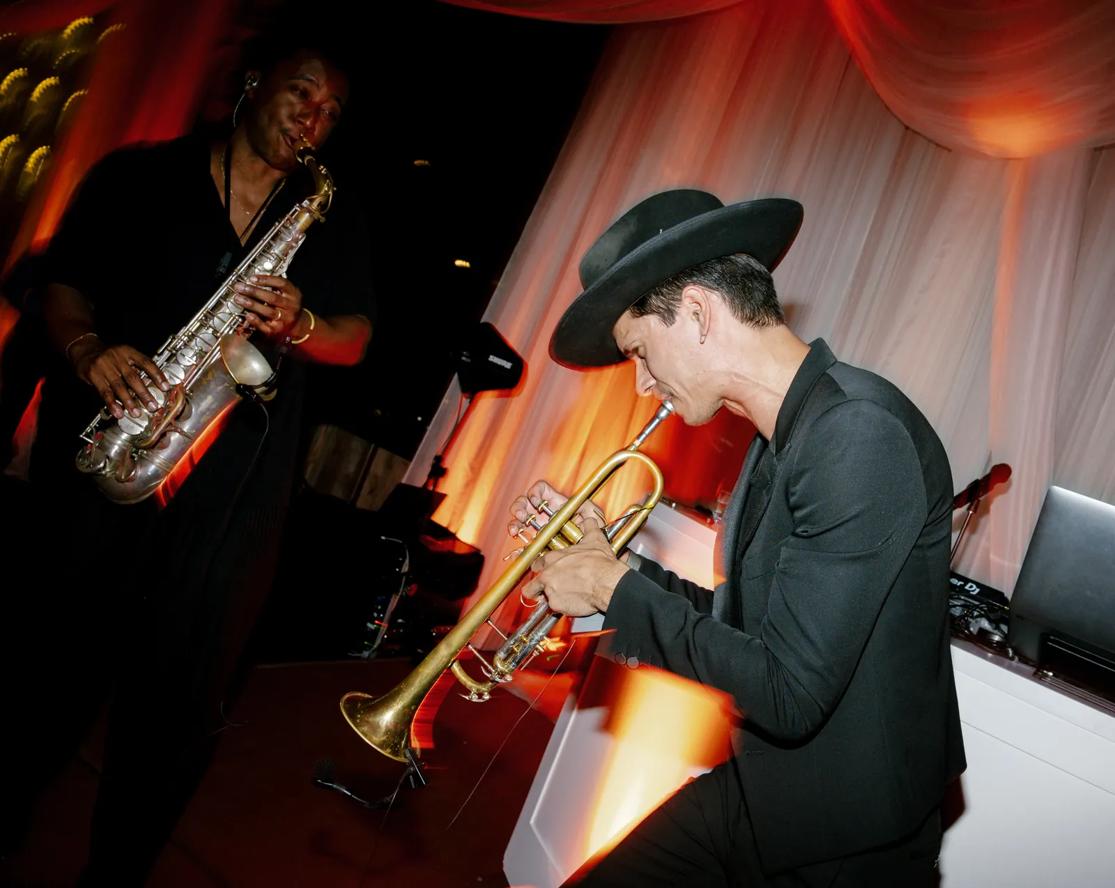 Saxophonist and trumpet player performing live during a wedding reception dance set