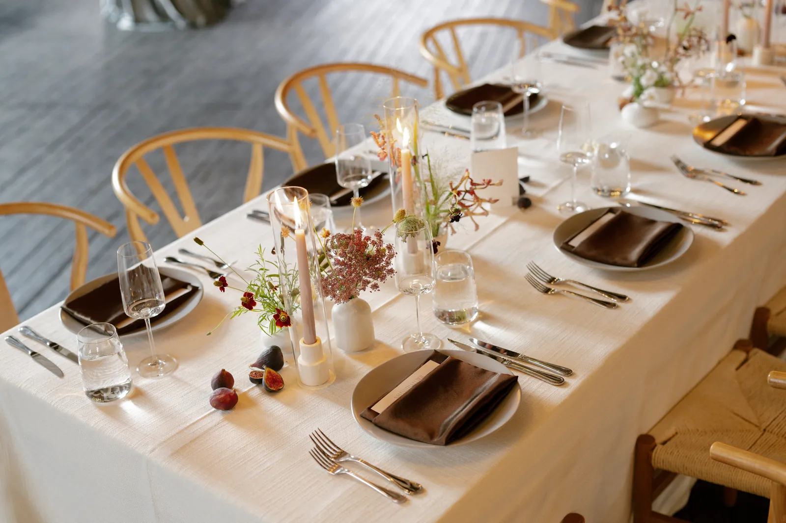 Candlelit reception tablescape with taper candles and florals at an elegant Idaho wedding