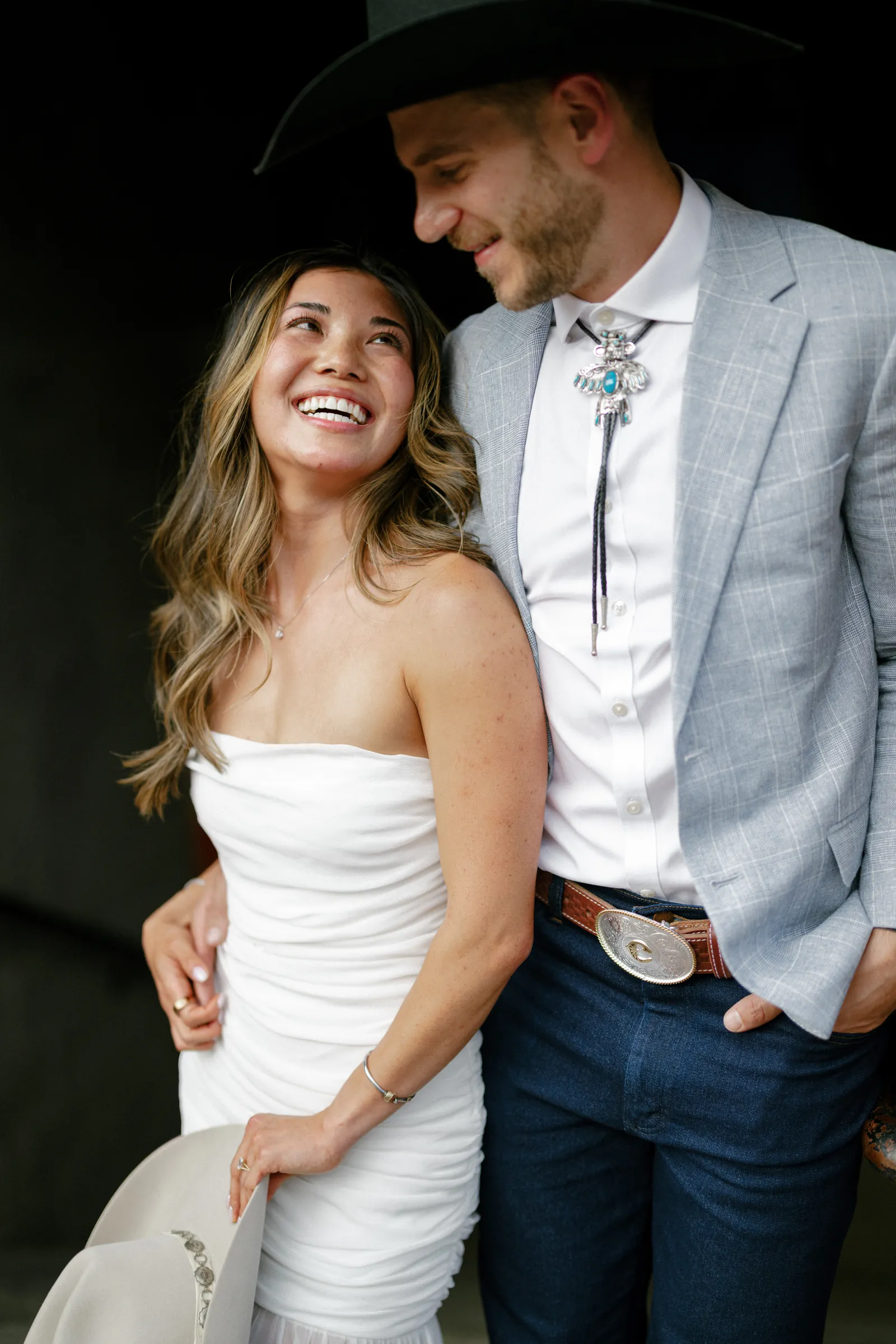Couple in western attire at their wedding welcome party